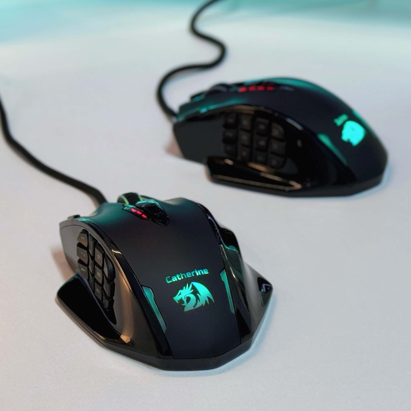 Two gaming mice with illuminated designs on a light background，Redragon EU