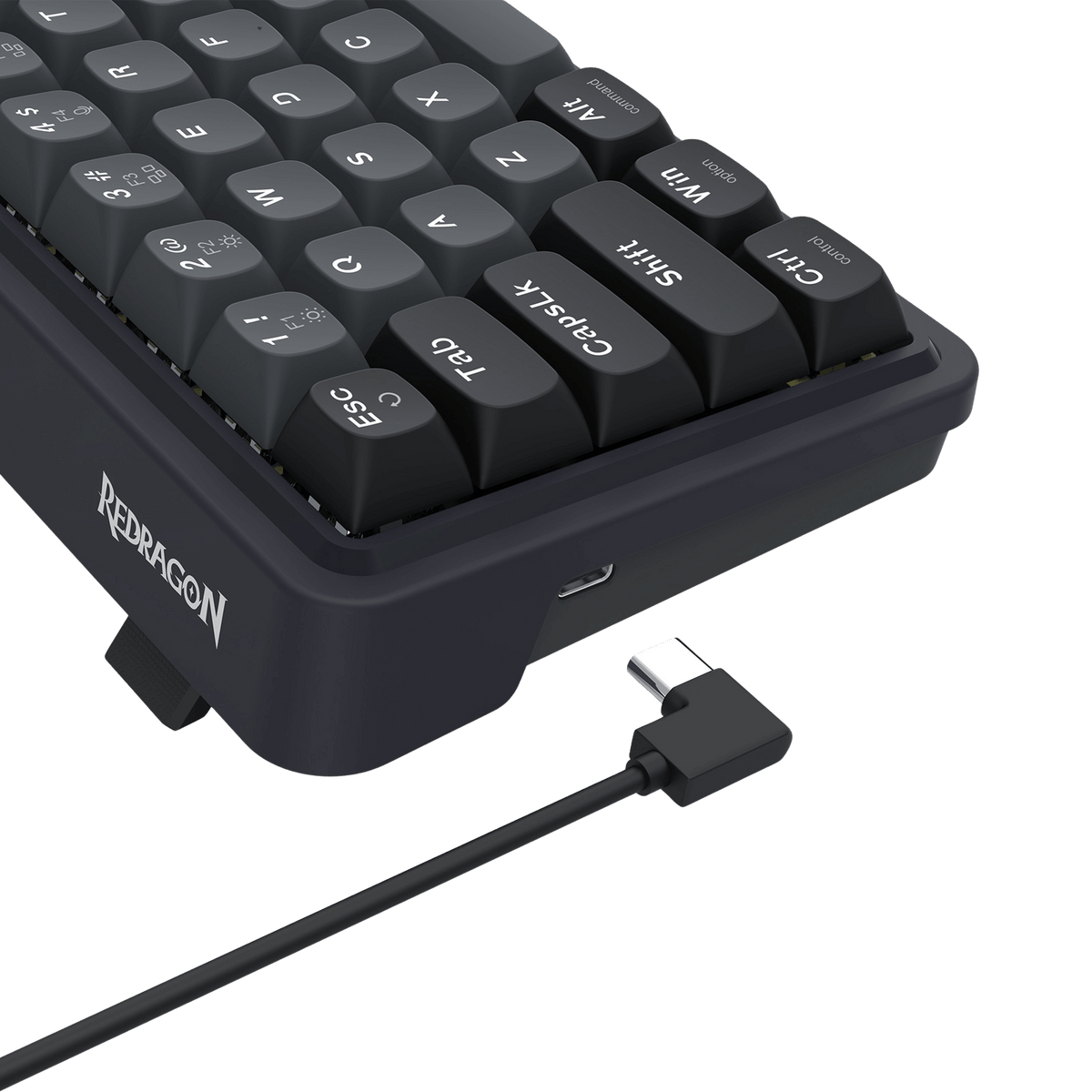 Black keyboard with USB cable on a black background, featuring the Redragon EU brand.
