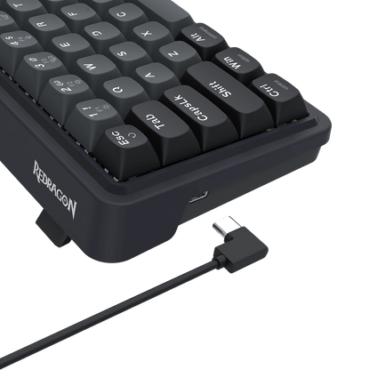 Black keyboard with USB cable on a black background, featuring the Redragon EU brand.