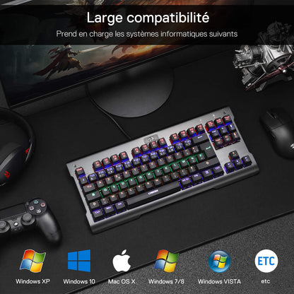 The keyboard is compatible with a wide range of operating systems (Windows XP/7/8/10/Vista, Mac OS X), shown here as part of a complete gaming setup with a controller and headphones.