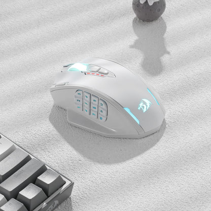 Redragon EU, A white gaming mouse with RGB lighting on a light grey surface next to a keyboard.