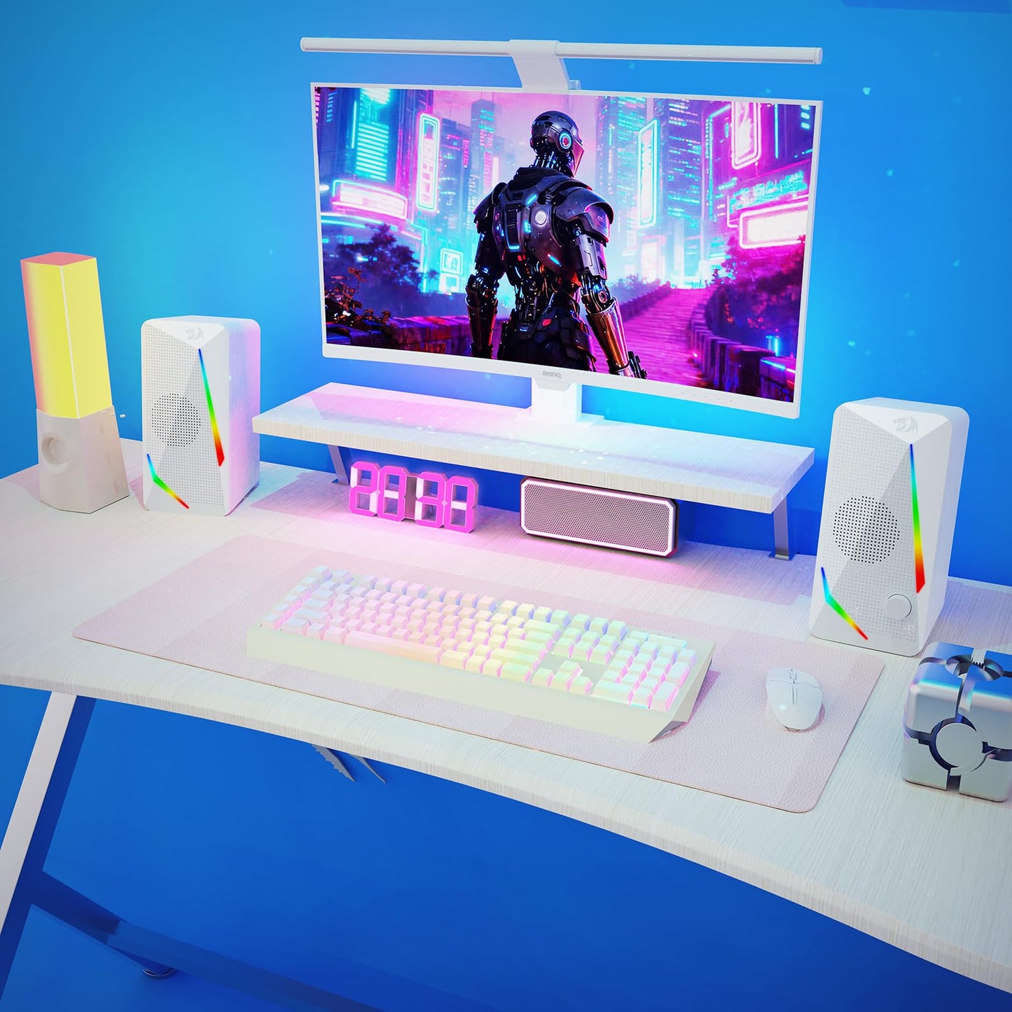 The speakers are shown in a vibrant RGB-lit gaming setup, alongside a mechanical keyboard, mouse, and monitor, enhancing the immersive experience, Redragon EU